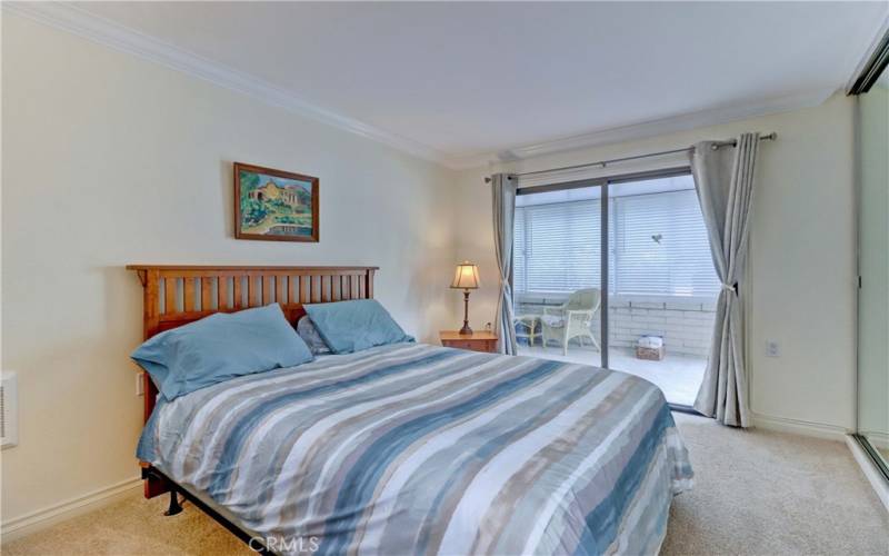 Guest Bedroom Sliding Glass Doors to Enclosed Balcony