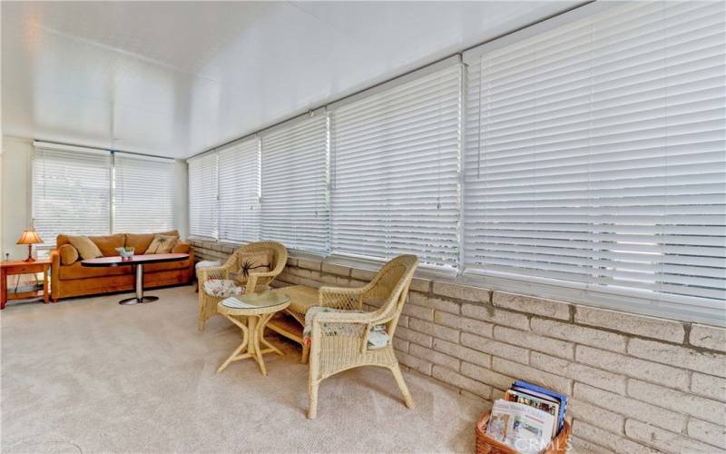 Enclosed Patio with door on both ends & doors into living room & guest bedroom