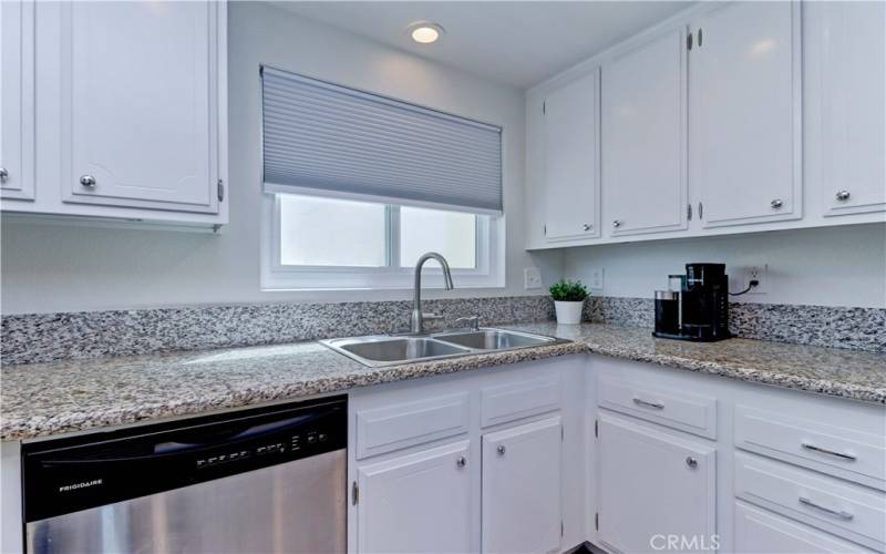 KITCHEN WITH DUAL SINK & WINDOW TO THE COURTYARD