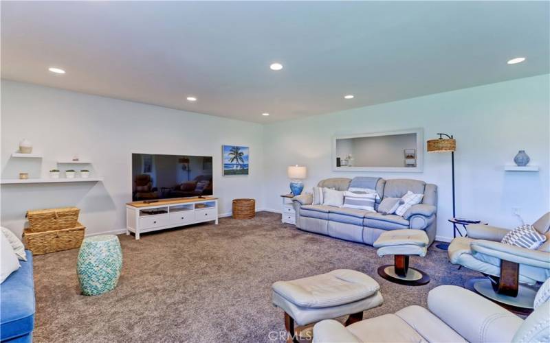 LIVING ROOM WITH RECESSED LIGHTING & 65' TV