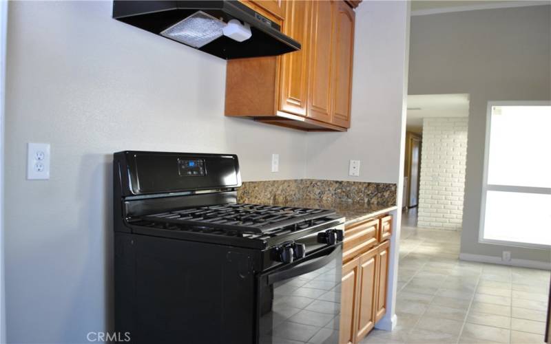 Kitchen with gas stove.