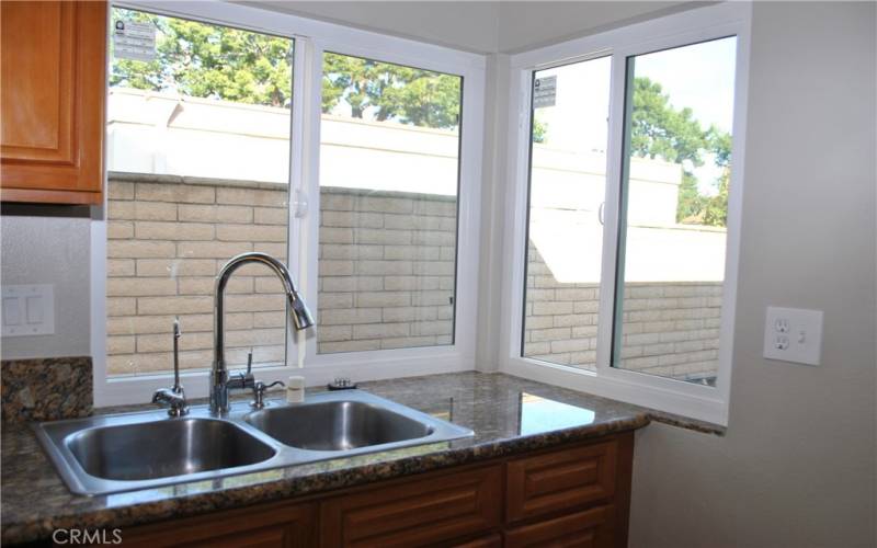 Double sink with granite counters.