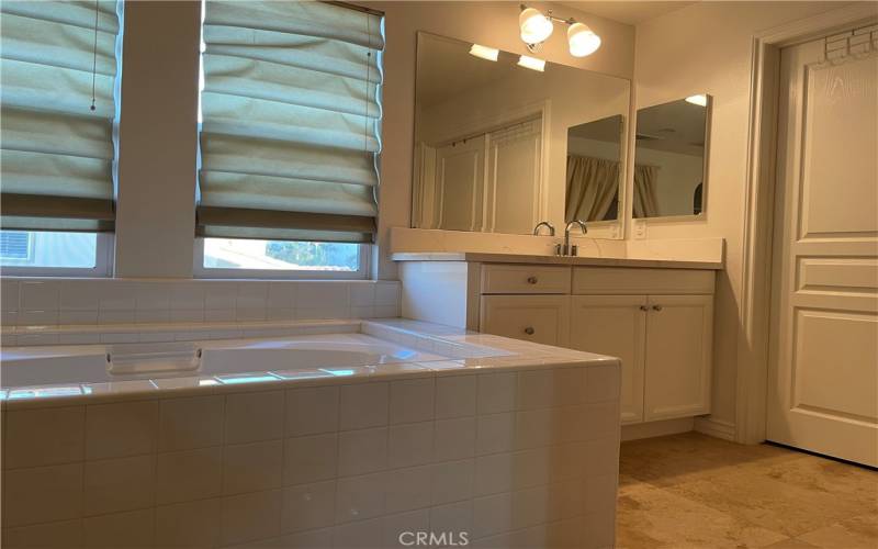 Master bath tub with his/her separate sinks