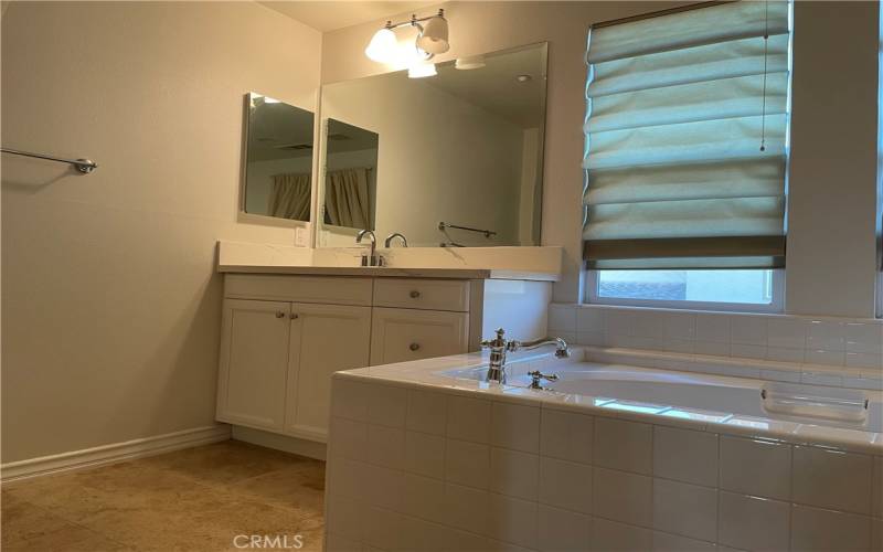 Master bathroom with tub and shower