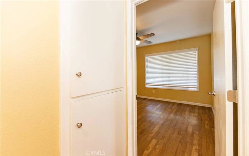 Hallway with cabinets going into Br 2