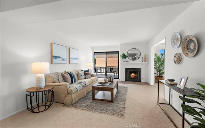 Living room with fireplace and balcony