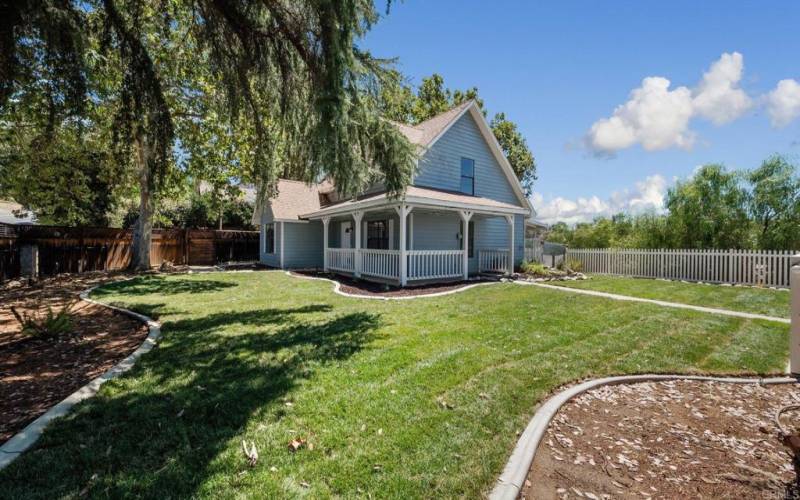 Front Porch With Views of the Beautiful Lush Grass