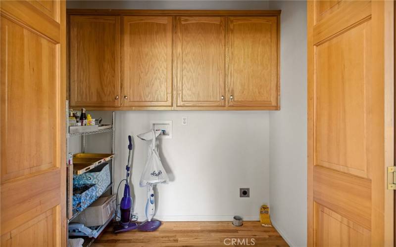 Laundry room with storage cabinets