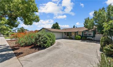 Handsome curb appeal with drought tolerant landscaping, a two car attached garage and a concrete driveway.