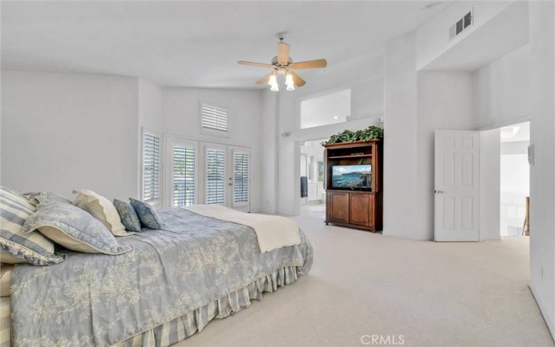 Master Bedroom with double door entry to private deck