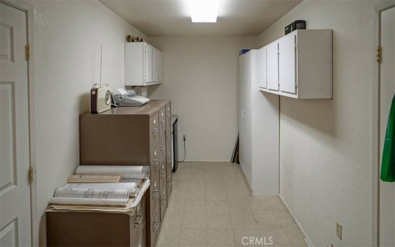 The middle room in Real Estate office.  There is a place for mini kitchen and file c cabinets.