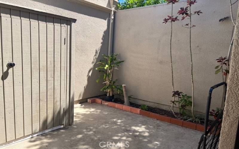 Cute little front patio - washer dryer is just behind the cabinet on the left.