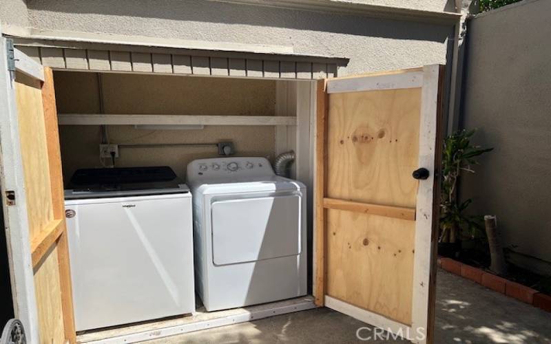 Full size washer and dryer is on the front patio.