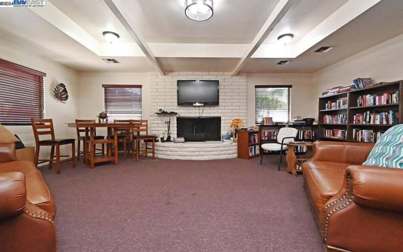 community library room with fireplace