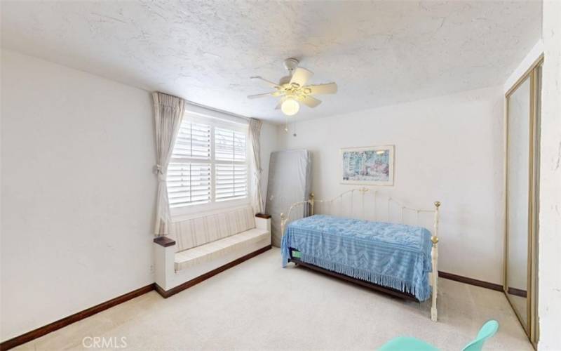 Upstairs bedroom with built in bench & Storage
