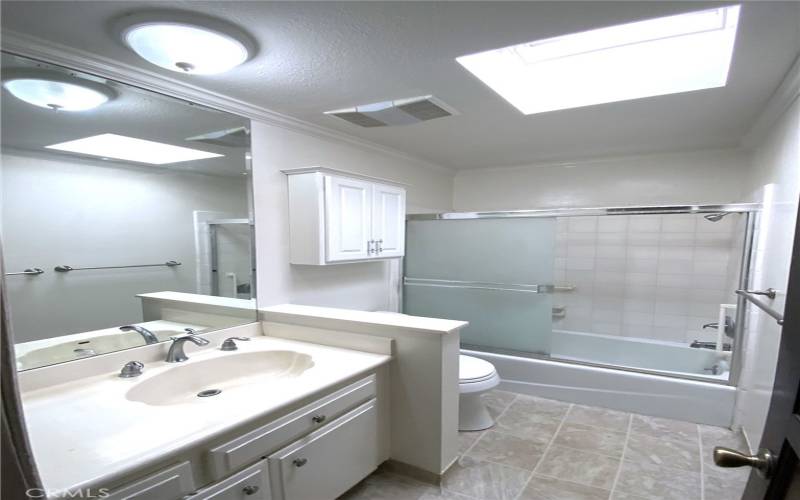 Upstairs hallway bath with skylight
