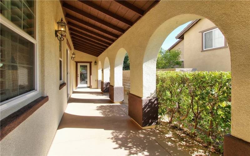 Side porch with side door leading into the kitchen.