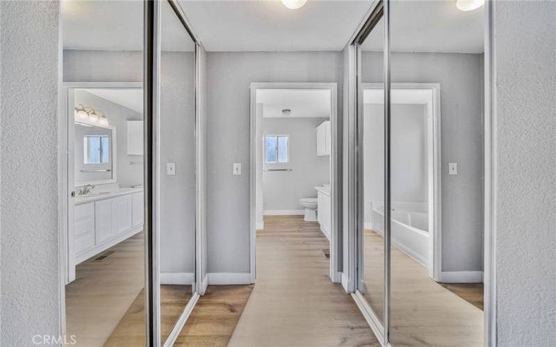 Mirrored closets into Primary bathroom