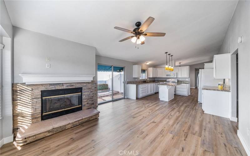 Front Living space with fireplace and kitchen