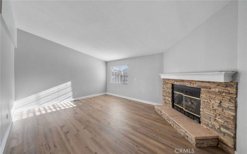 Large Family Room vacant with fireplace