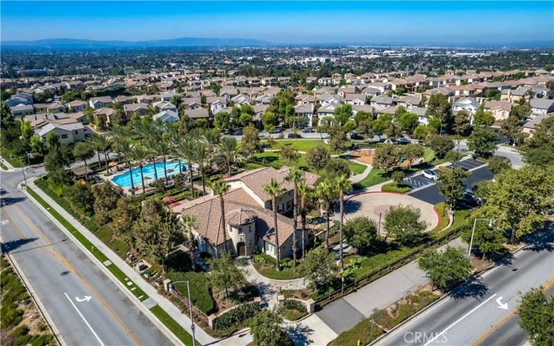 Aerial view of “The Resort” - a 4,592 sq ft clubhouse w/  1,058 sq ft meeting room, kitchen, offices, private fitness center, 75’ junior Olympic swimming pool, spa and children’s wading pool totalling 2 acres