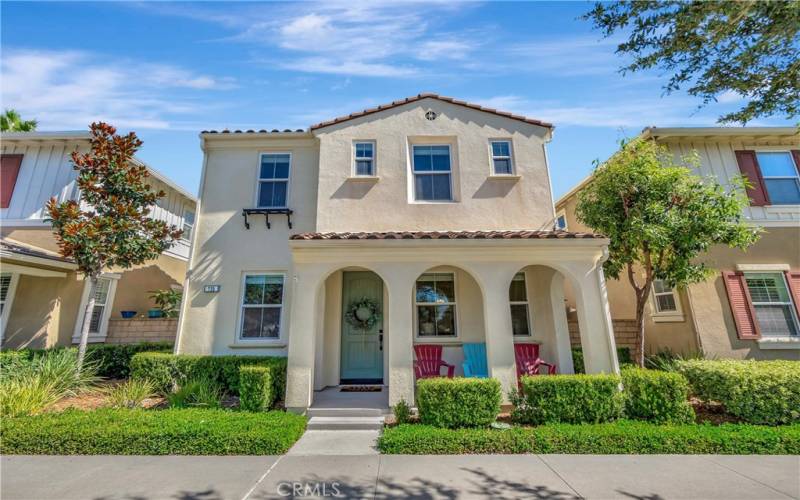 Front view of Spanish revival style home w/ covered front porch