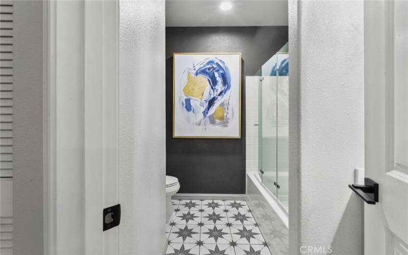 Guest bathroom- tub with bifold door.