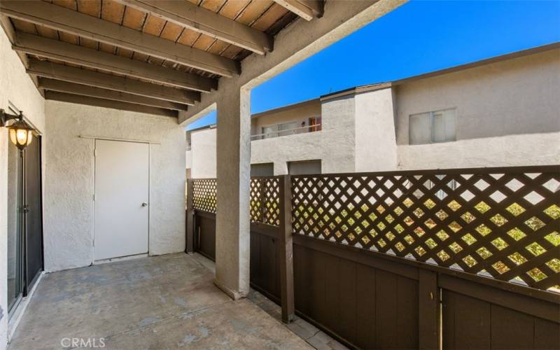 Here is the private patio with a view of the storage closet door