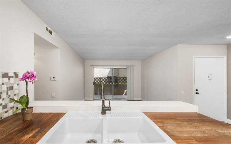 View from the sink out to your living room and the private patio