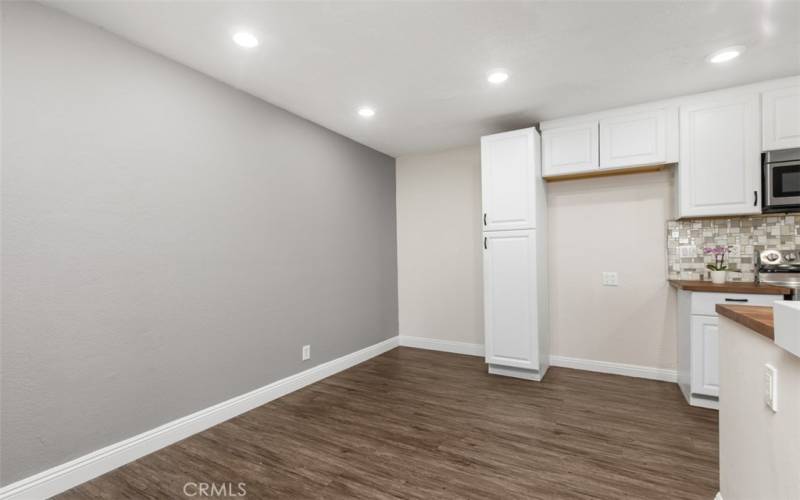 Dining room area next to the kitchen with Laminate flooring