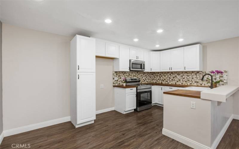 There is also a pantry cupboard for kitchen items