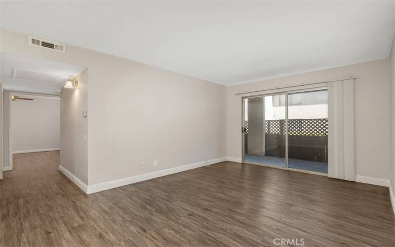 View from the dining area to the living room also the laminate flooring