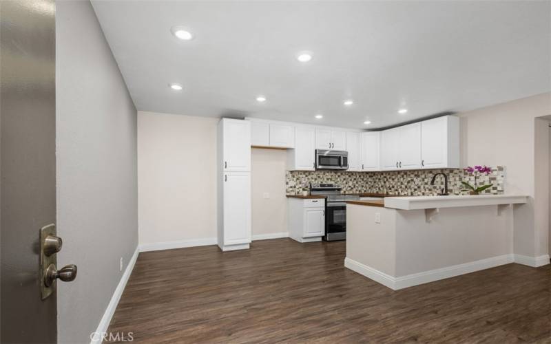 View from the front door to the dining area and kitchen