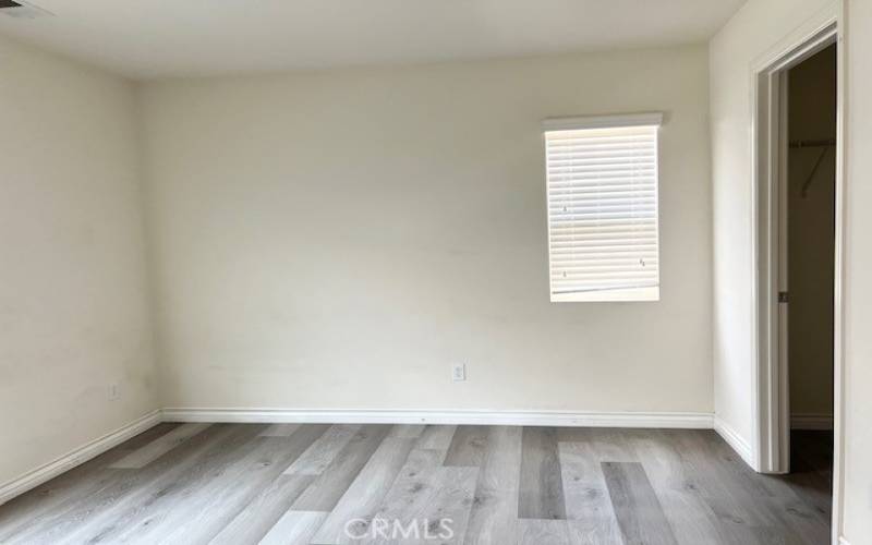 Bedroom with walk-in closet