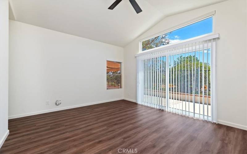 Primary bedroom opens to the rear patio