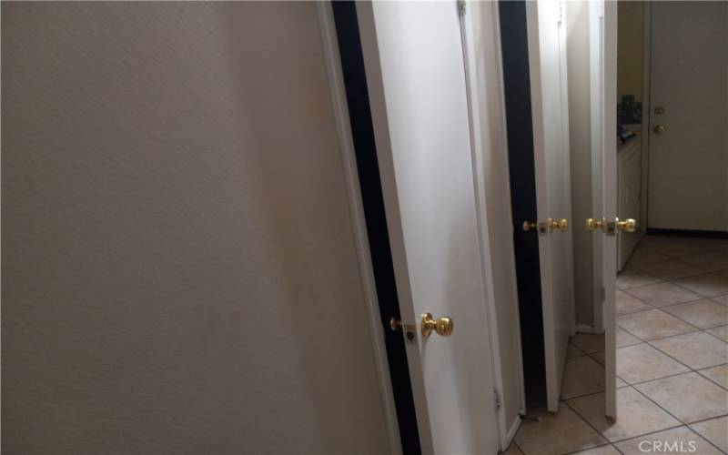 Two hall closets walking into laundry room