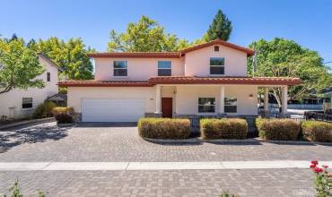 Front of Home with cobblestone drive