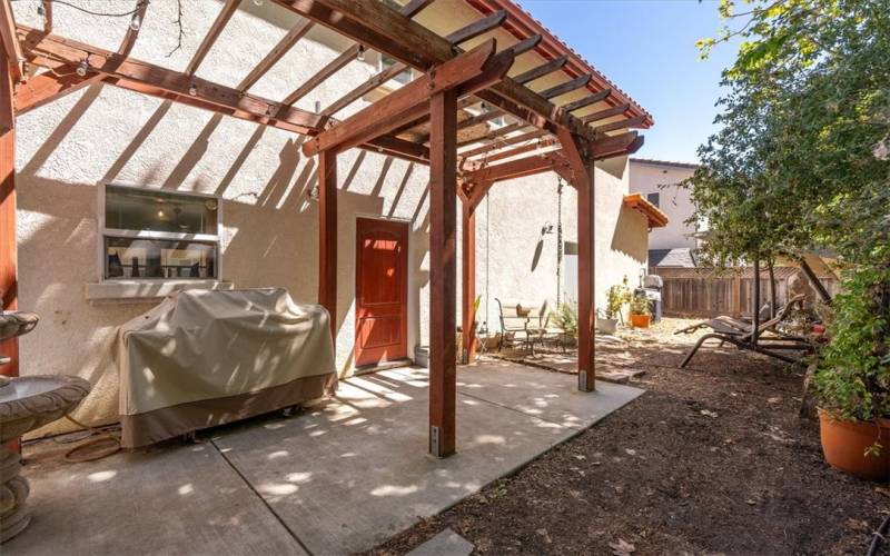 Private backyard area with garage and kitchen access