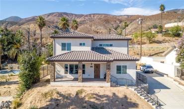 Perched at the top of the street, this recently built home offers a beautiful view of the hills