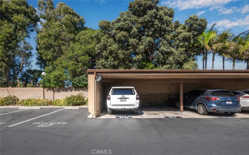 Corner carport space #86 with storage lockers.