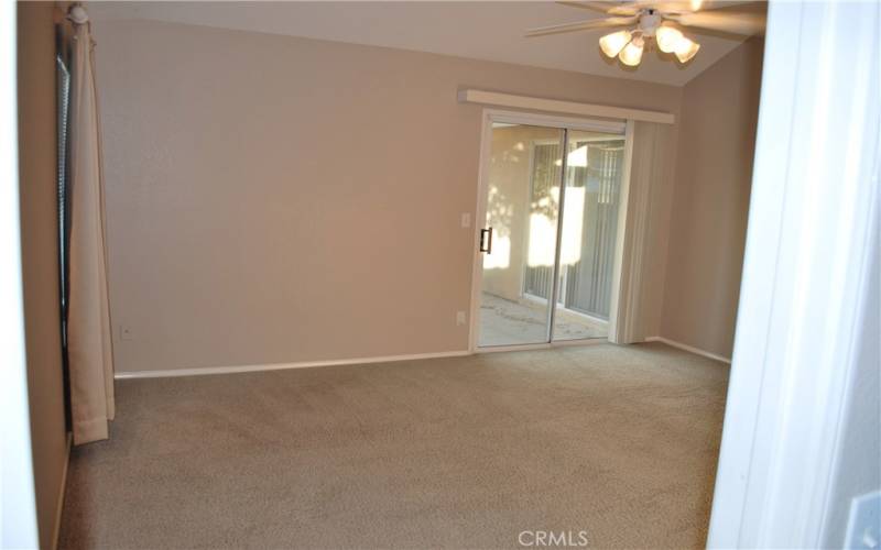 MASTER BEDROOM WITH SLIDING DOORS TO PATIO