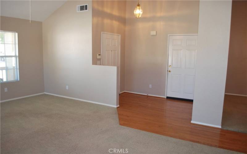 ENTRY DOOR FROM OUTSIDE ON THE LEFT AND GARAGE DOOR ON THE RIGHT