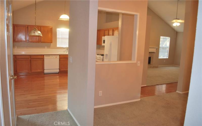 VIEW OF KITCHEN, DINING ROOM AND LIVING ROOM FROM THE HALL.PARTITION MAYBE BE REMOVED FOR OPEN CONCEPT