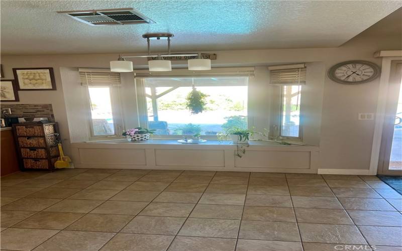 Breakfast Nook with Bay Window Overlooking Backyard