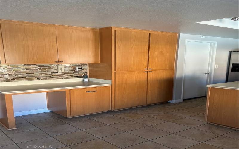 Pantry and Desk with door to Laundry Room