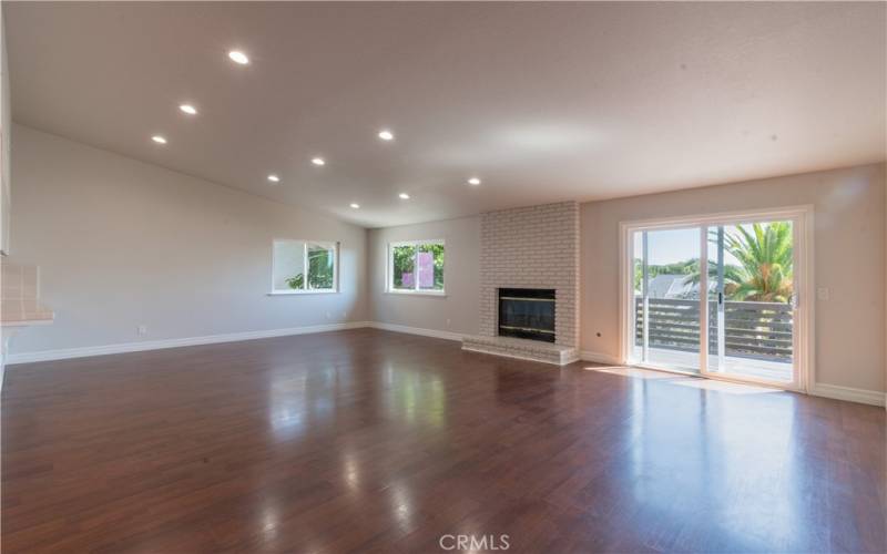 Great room with fireplace and slider to deck