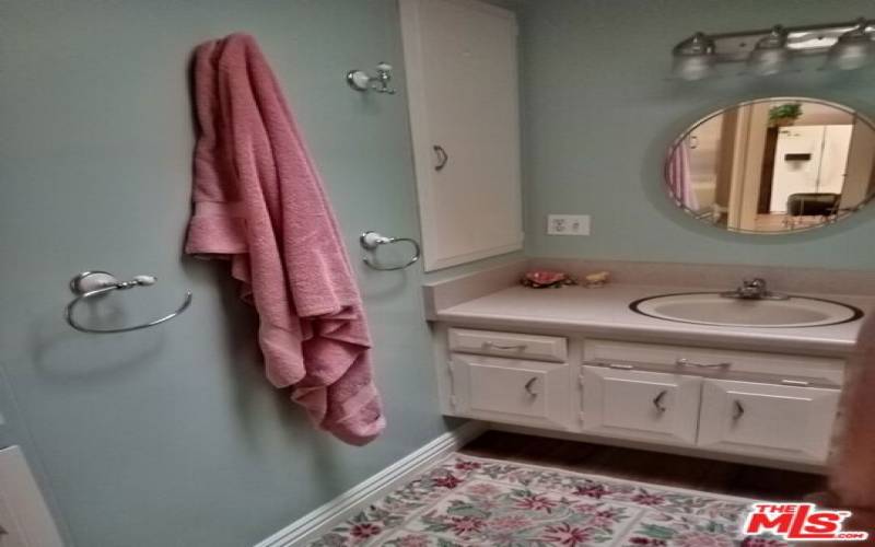 bathroom with decorator colors and pulout shelves