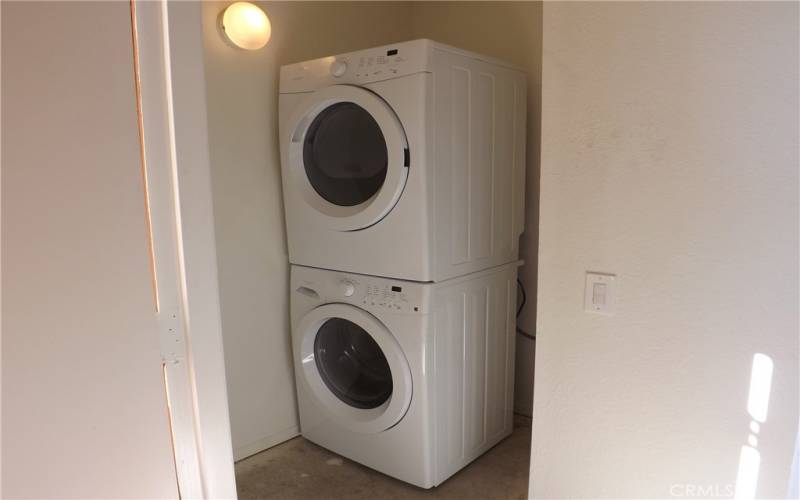 The washer/dryer is located just outside the living room off the patio deck.