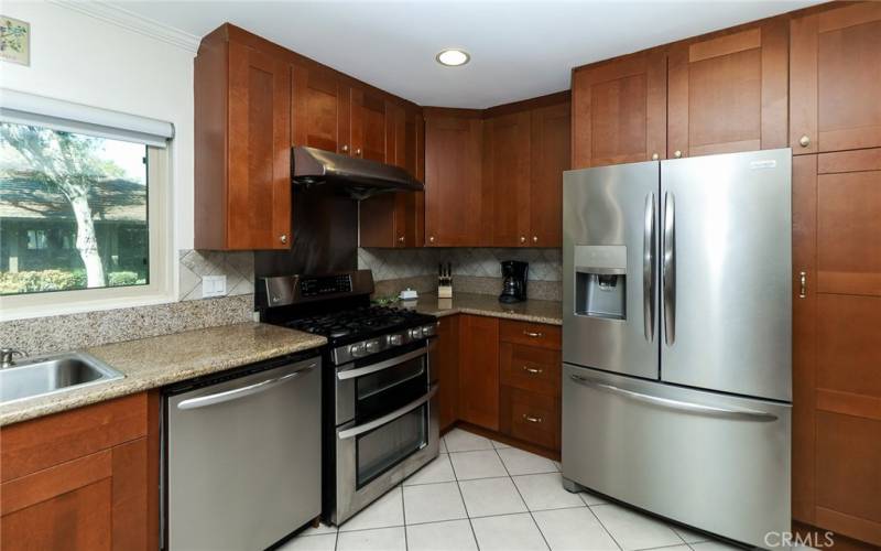 Updated kitchen w granite countertops and stainless steel appliances