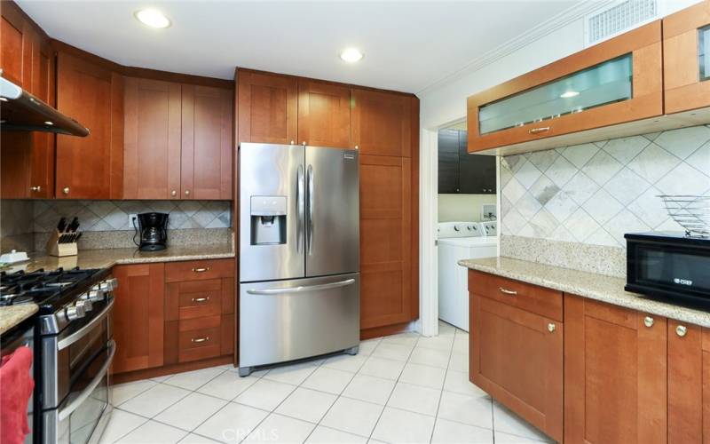 Updated kitchen w granite countertops and stainless steel appliances